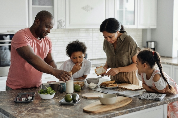 Family making breakfast in their new home