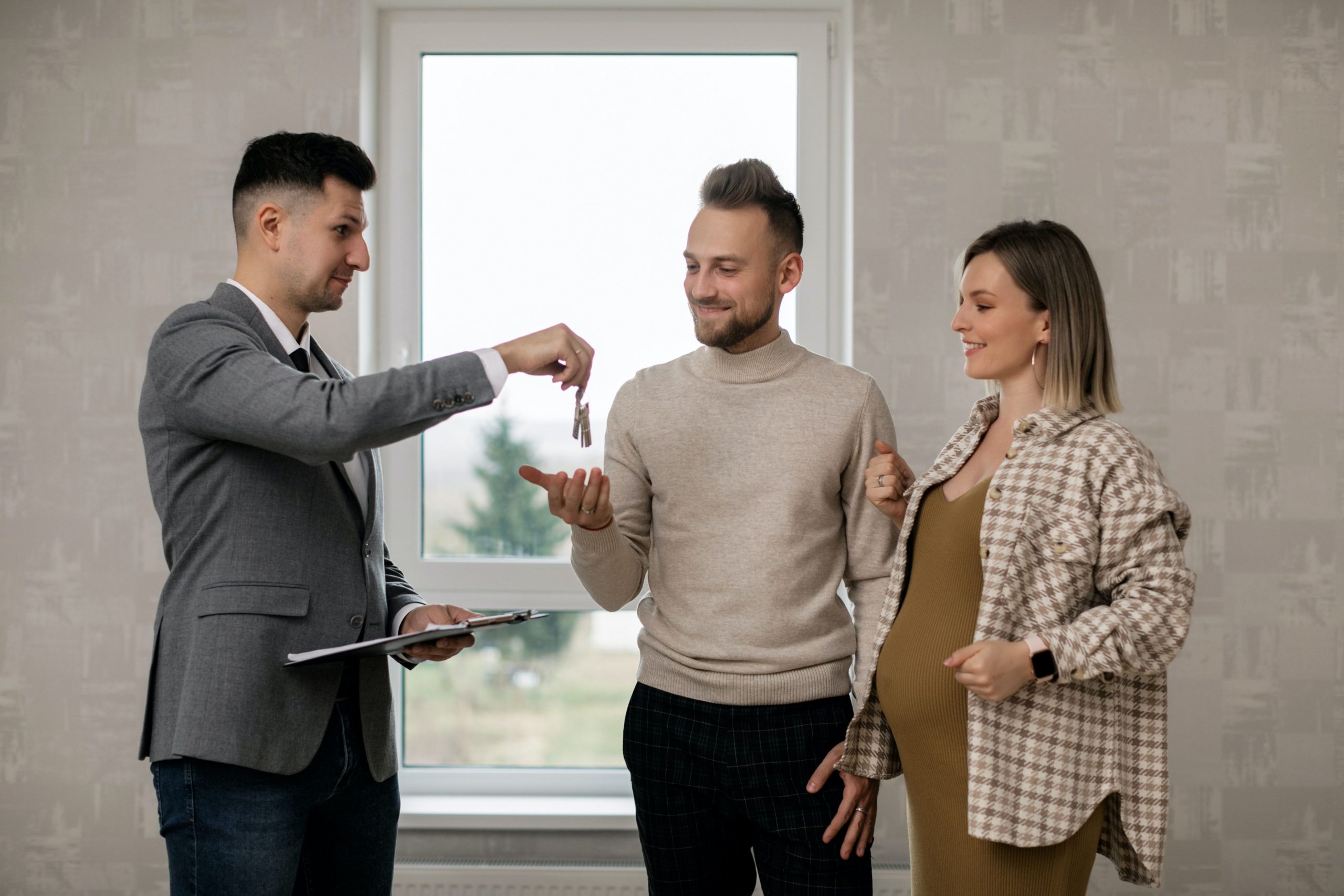 Pregnant woman collecting house keys