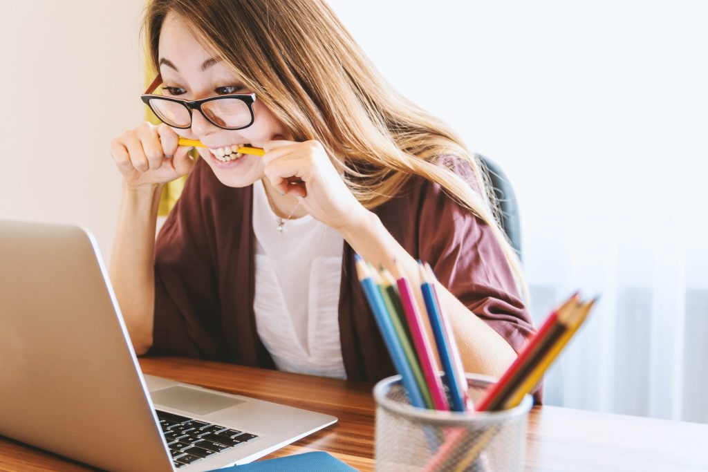 Stressed woman at laptop